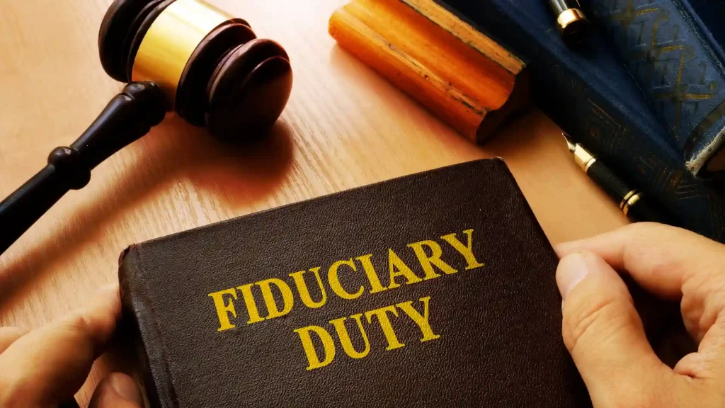 Book titled 'Fiduciary Duty' on a desk with a gavel and law books.